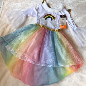 Hide and seek.  Rainbow unicorn costume - girls large